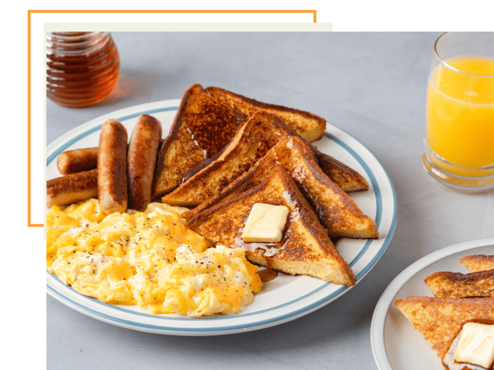 French toast, sausage, eggs and orange juice